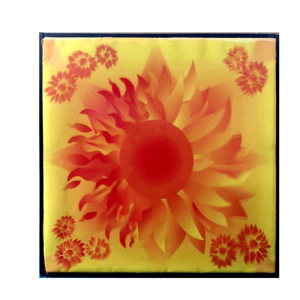 A centered image that is half sun with flaming rays and half sunflower with bright petals